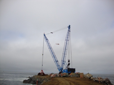 Kiewit placing 35-50 ton rocks at the end of the No. Jetty